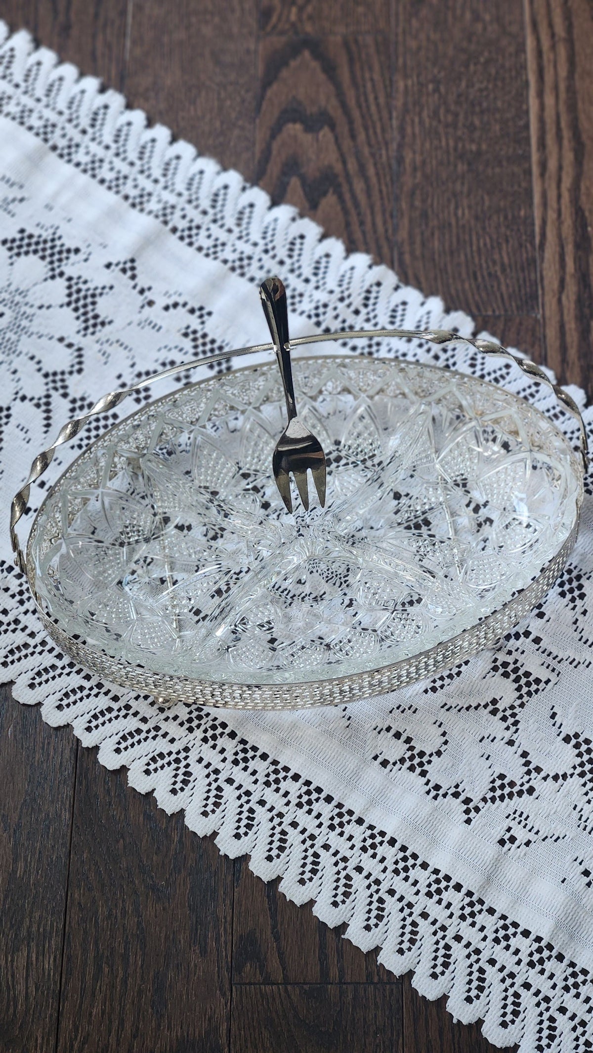 Top view of divided pressed-glass relish insert and included serving fork