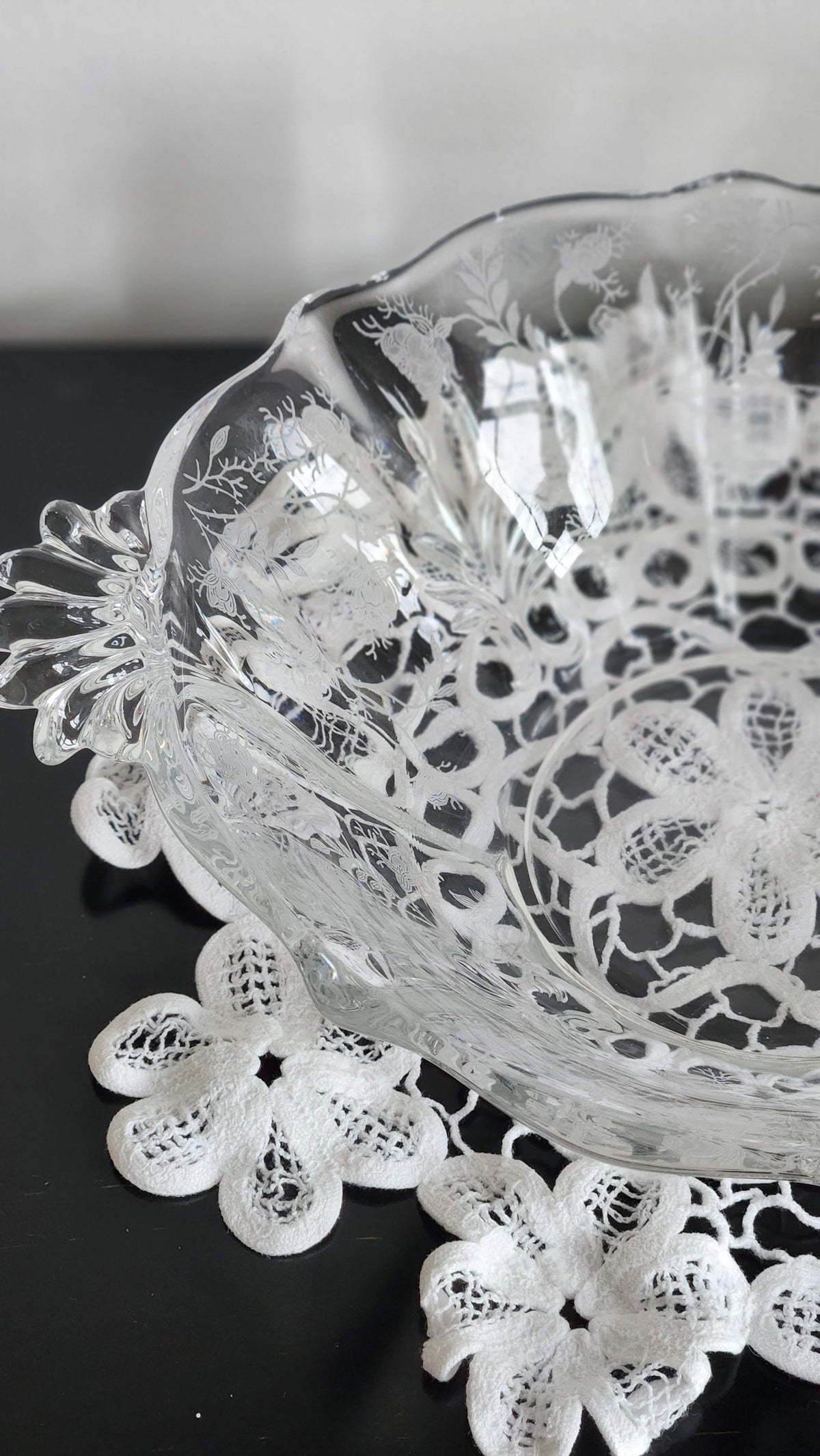 Close view of etched glass bowl on display easel, easel not included