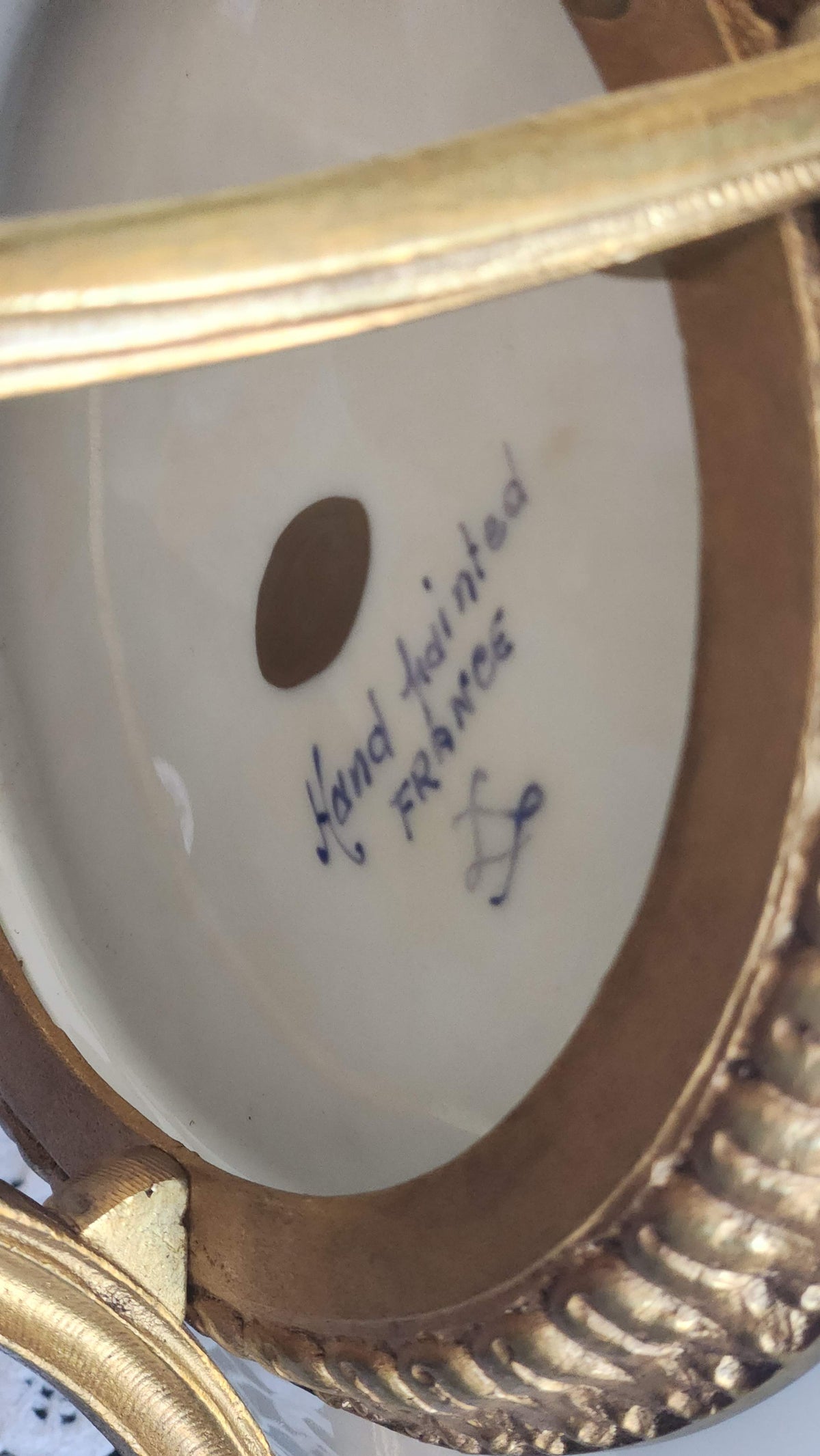 Underside of porcelain centerpiece marked Hand painted France