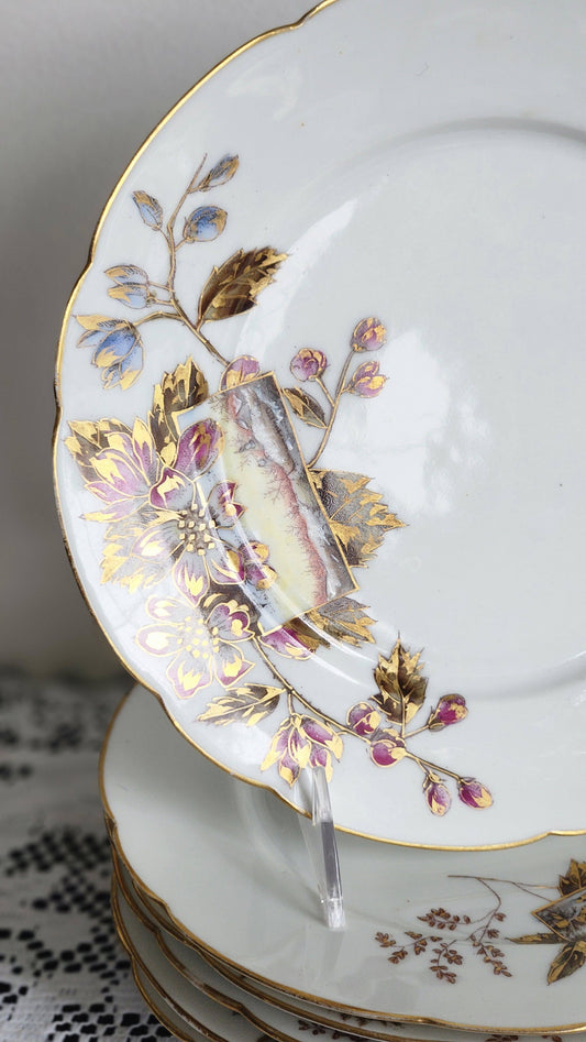 Set of 6 antique H. Delinieres Limoges dinner plates with gold rim and floral decoration, close up