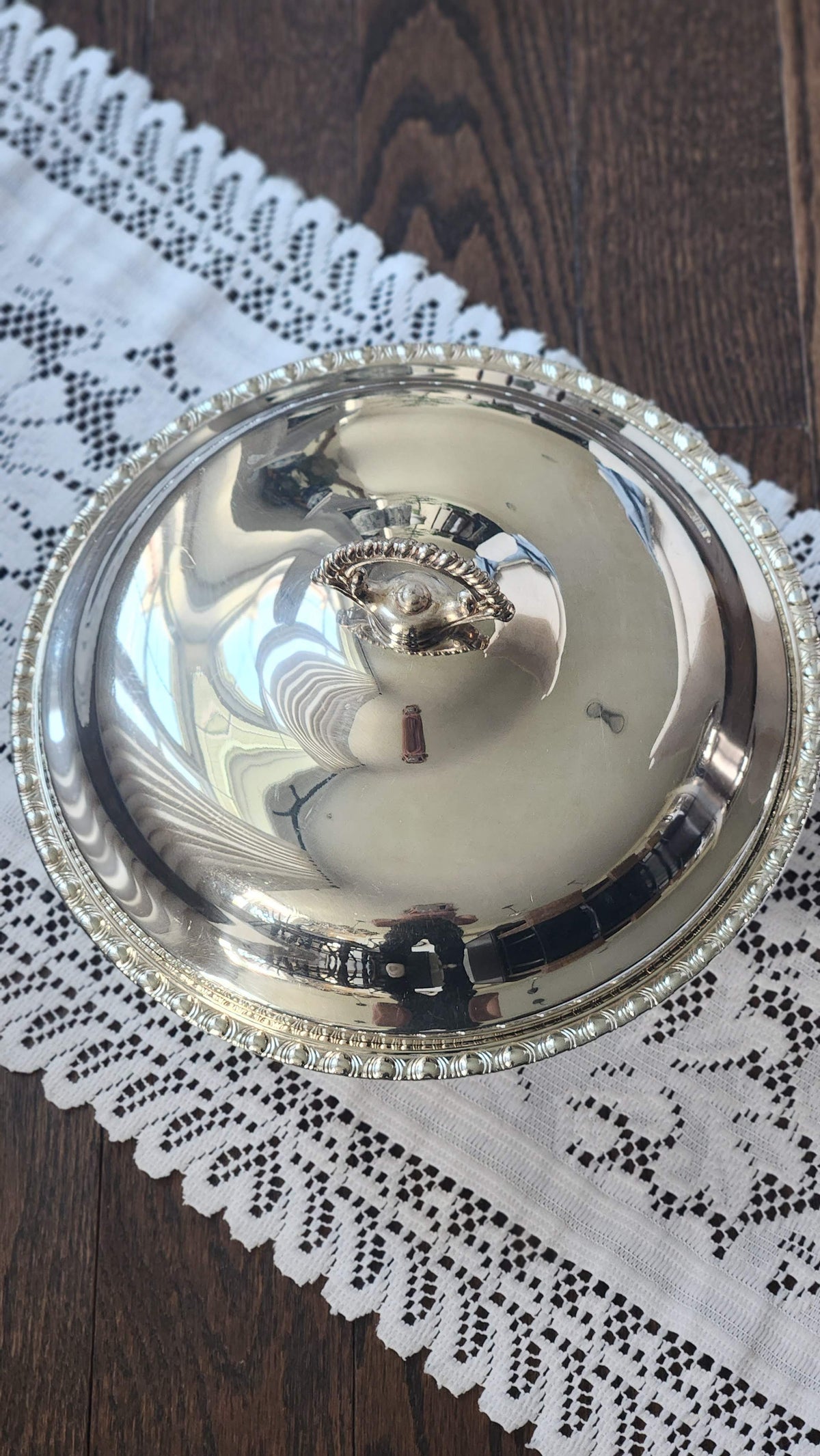 Top view of domed silverplate casserole lid and gadroon border