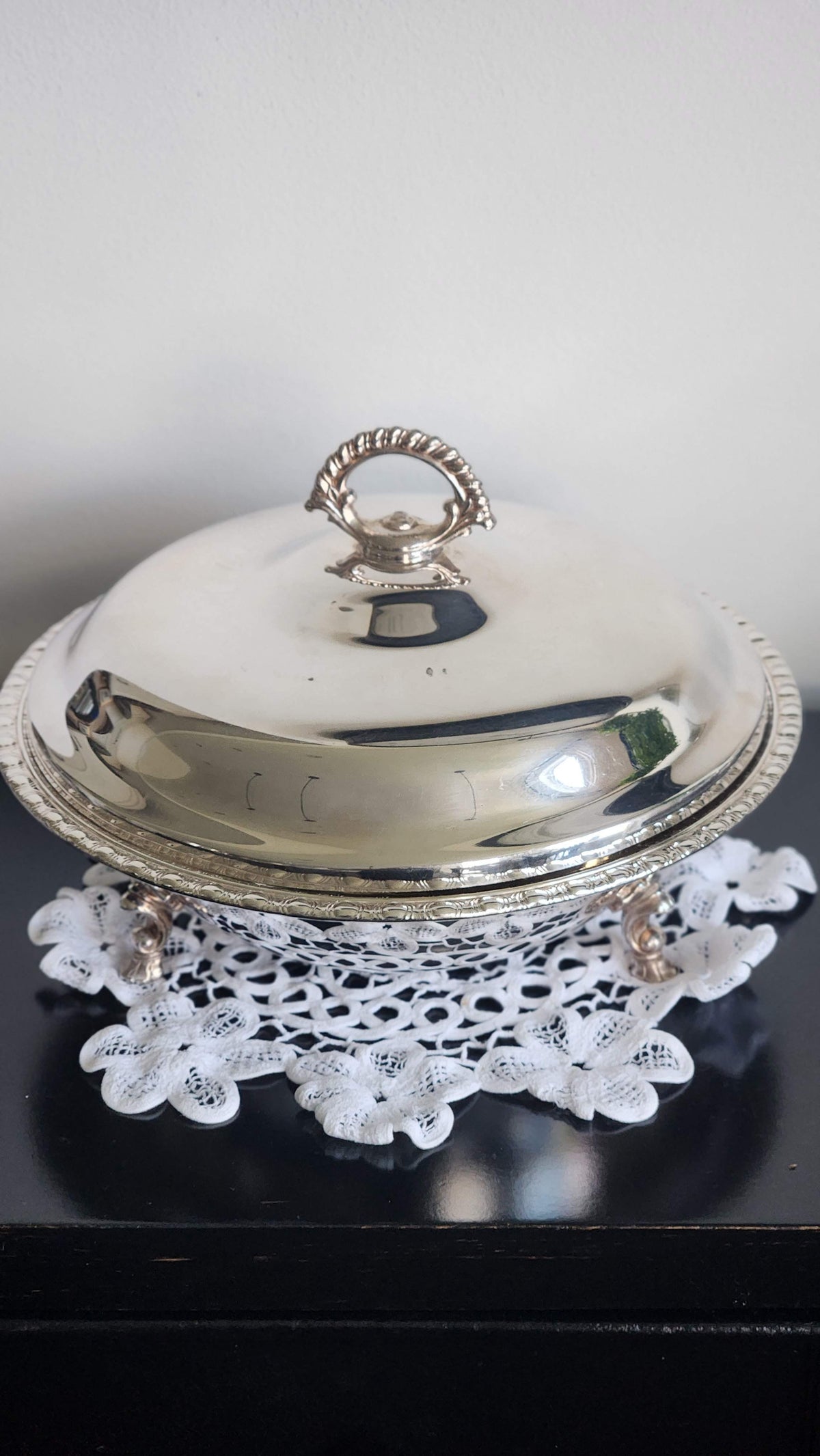 Vintage silverplate covered casserole with ring handle, gadroon rim, and decorative feet