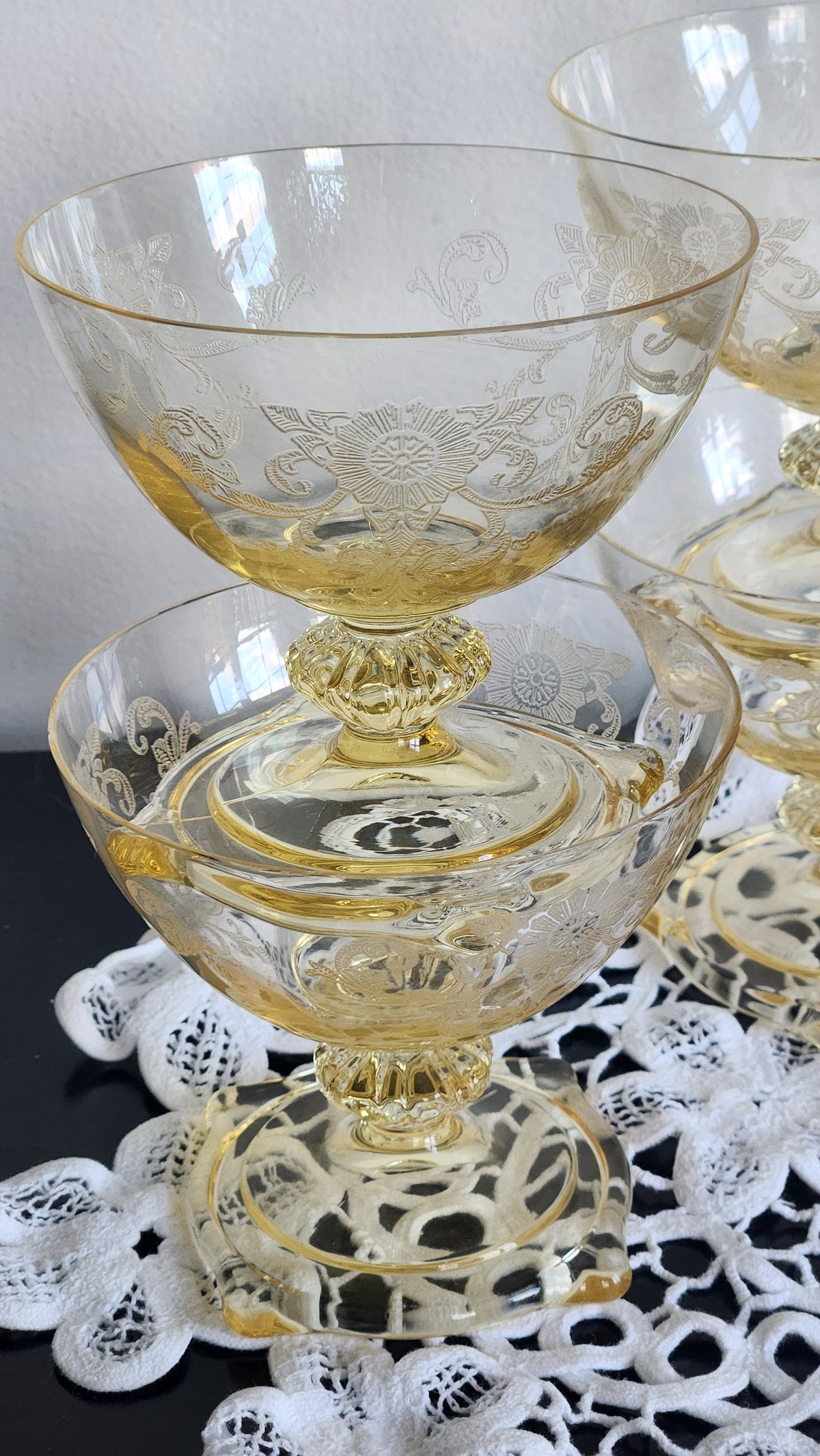 Set of four yellow etched glass sherbet and champagne coupes with short decorative stems