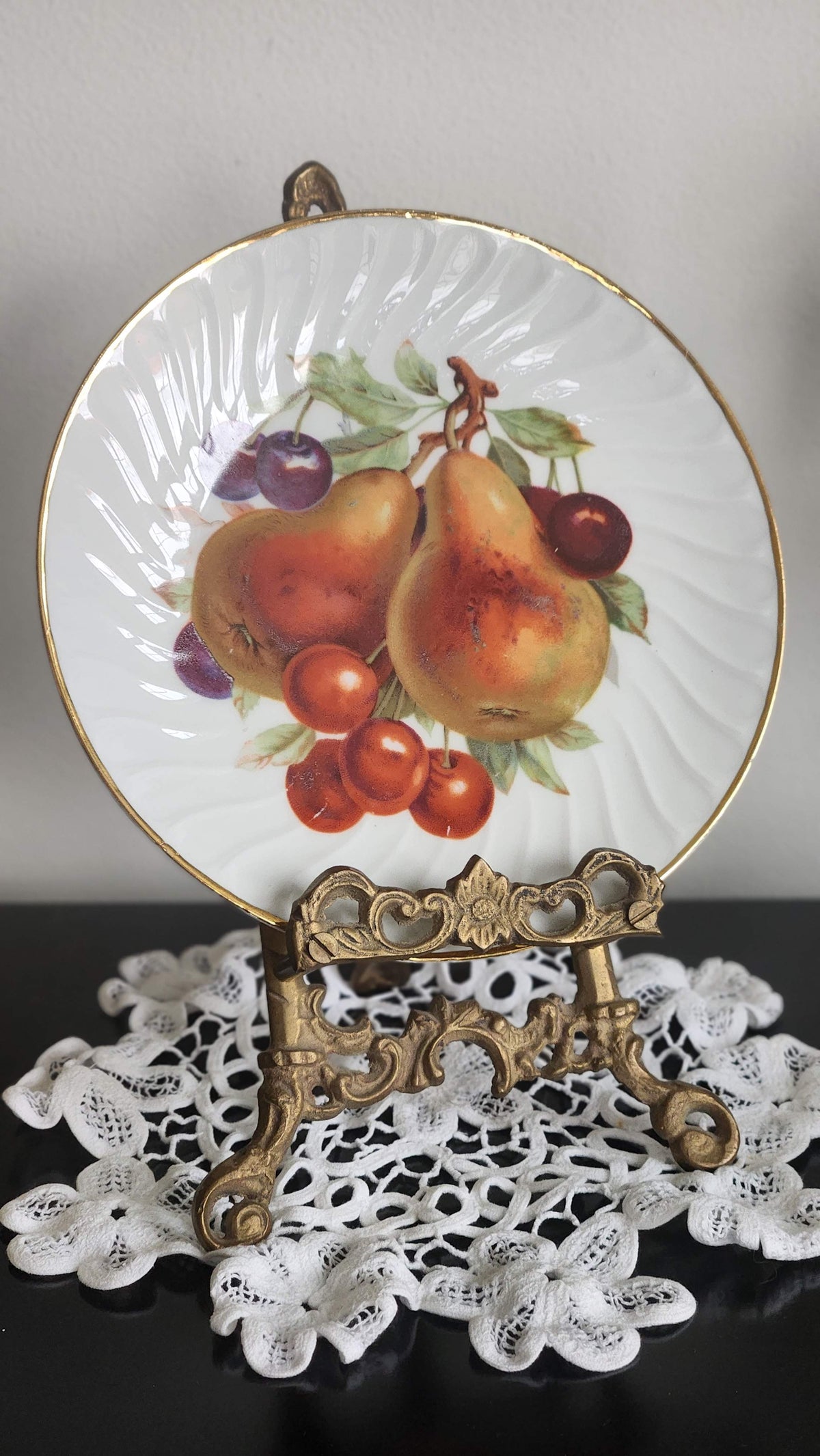 Vintage porcelain fruit plate with pears, cherries, swirl rim and gold trim; easel not included