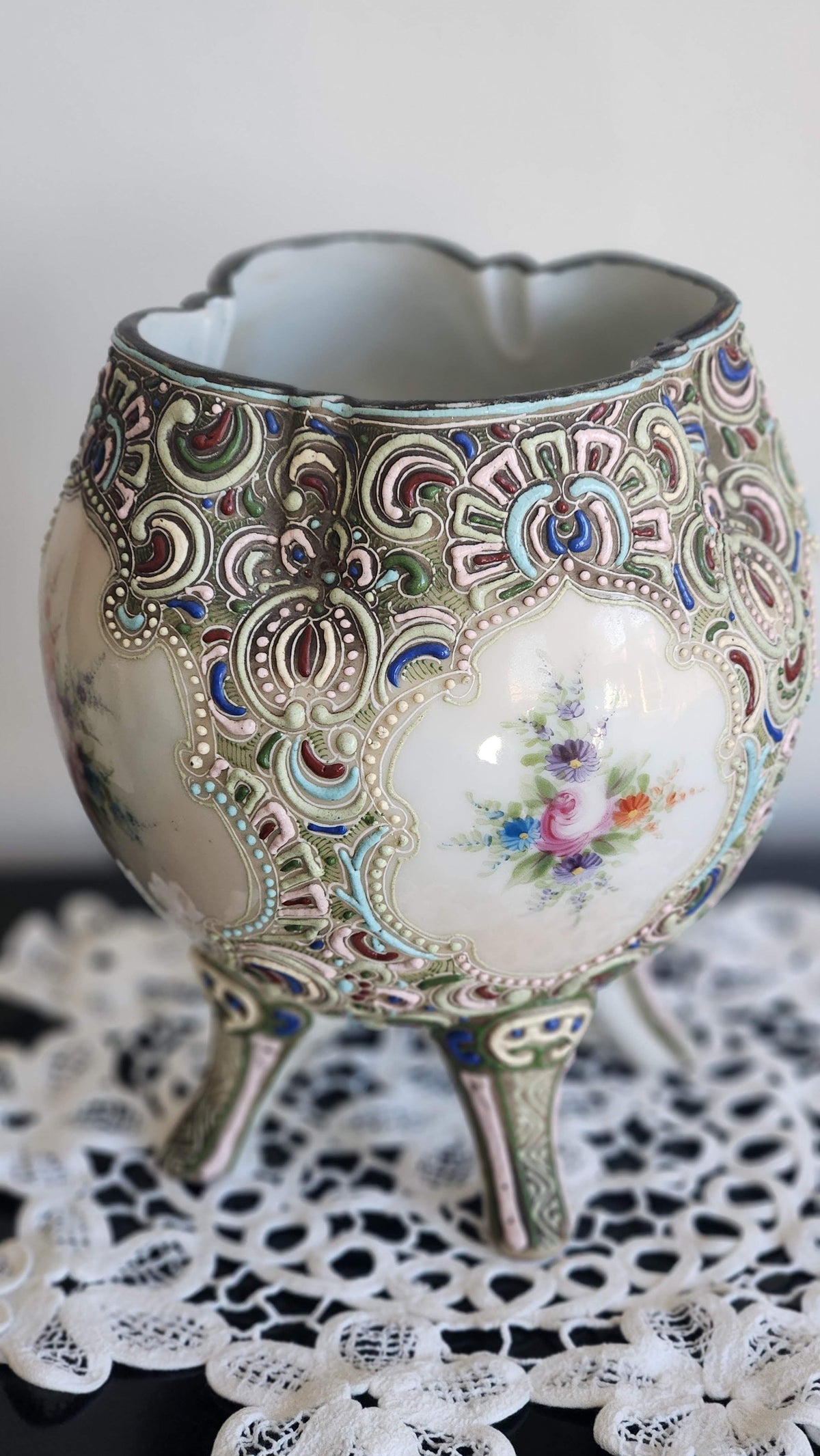 Three-legged antique vase with hand-painted roses and colorful raised moriage scrollwork