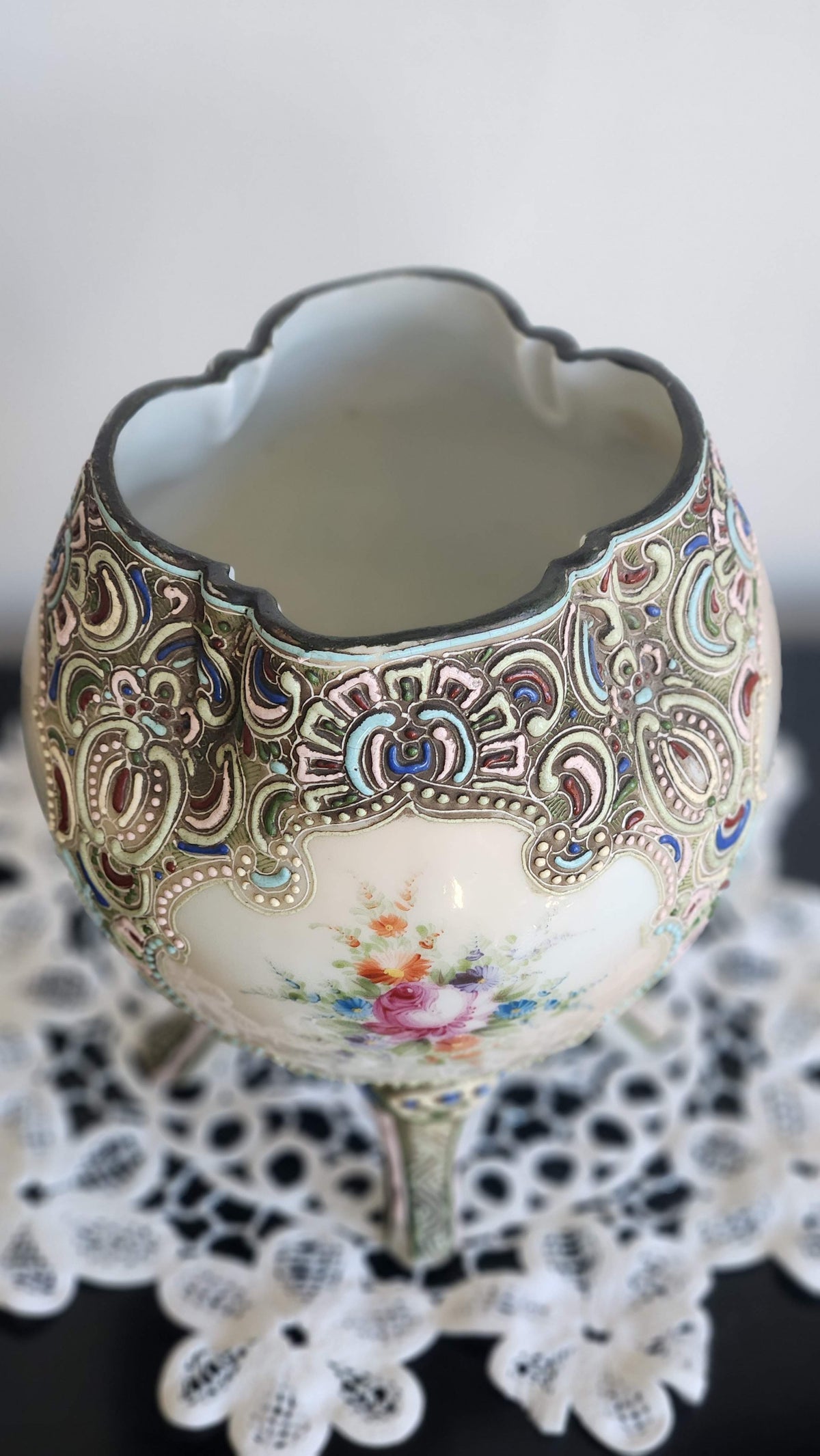 Scalloped opening and raised enamel decoration on antique floral vase