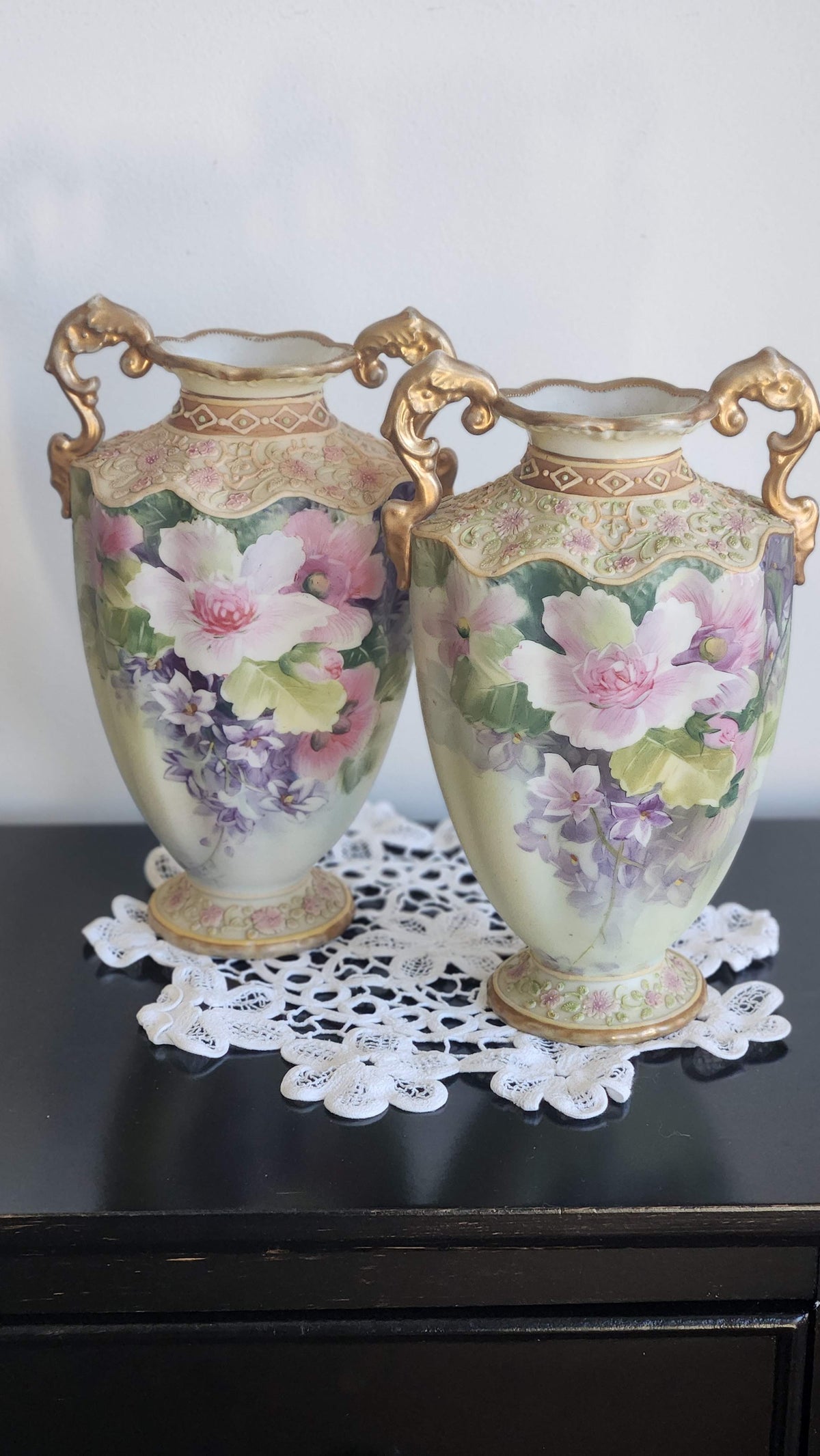 Pair of hand-painted floral Nippon vases with ornate gold handles