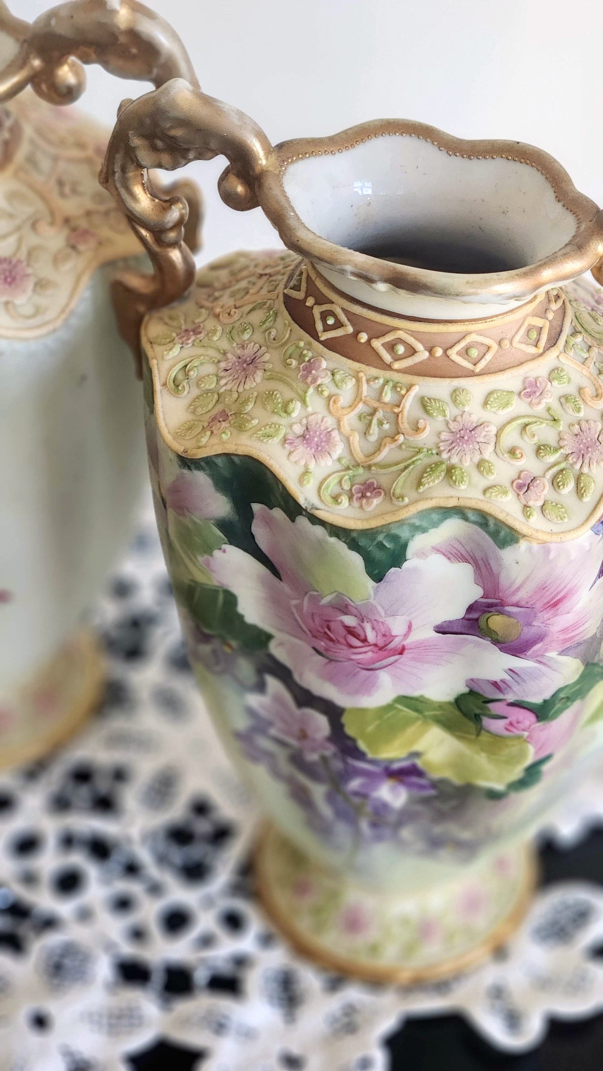 Close-up of raised moriage decoration and gold accents on floral Nippon vase