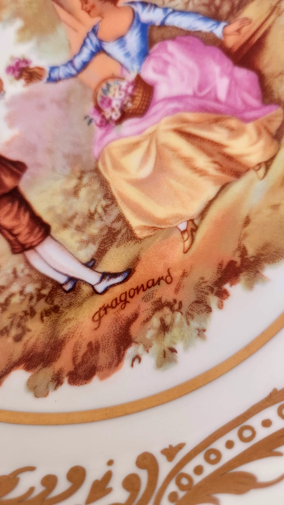 Close-up of Fragonard name within the decorative courting scene